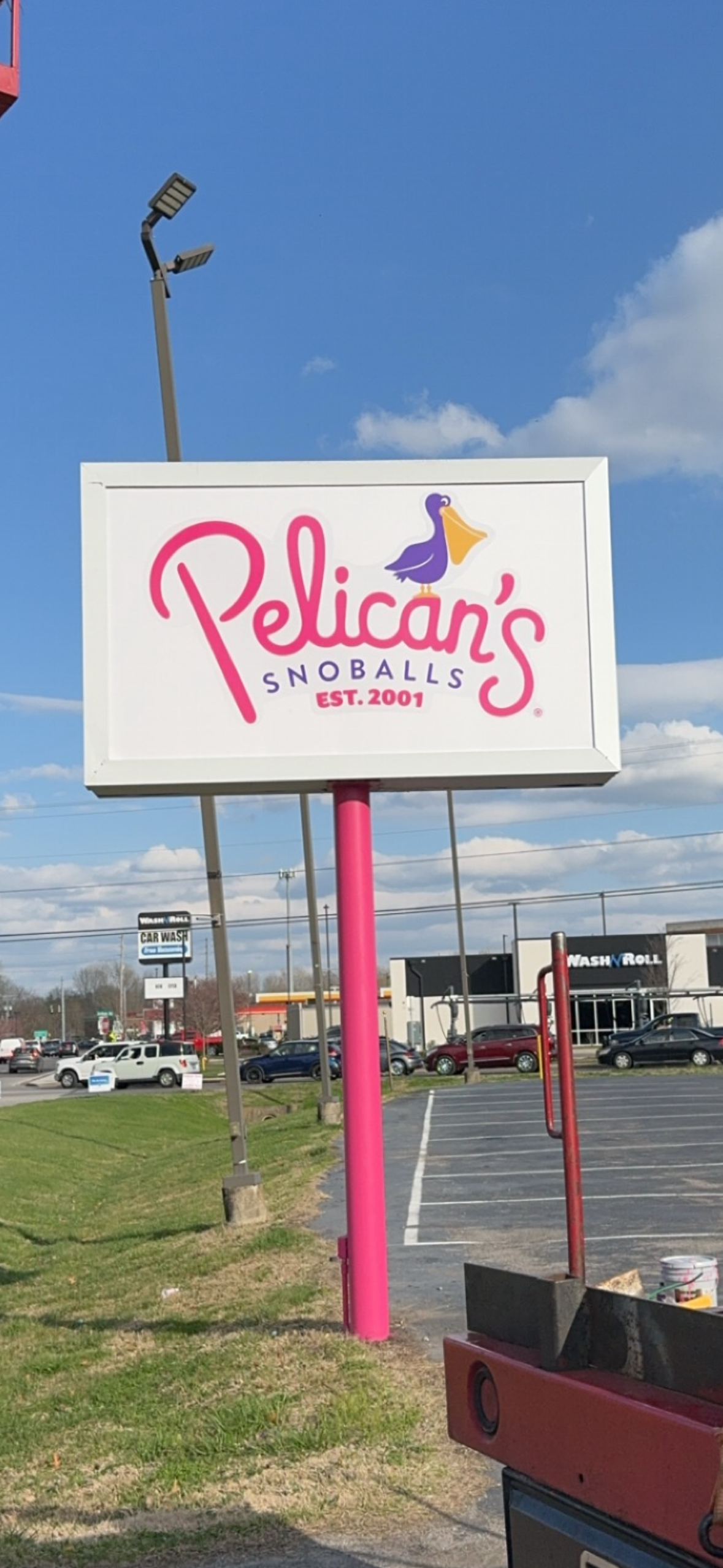 Pelican's Snoballs post sign
